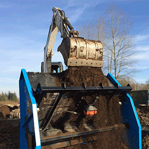 Screened material output